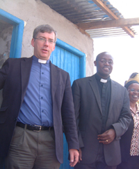 Andy and Julius pray for God's blessing at the latrines