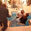 Paul Gale is baptised, being immersed in the baptismal waters