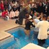 Paul Gale prepares to become the second person to be baptised