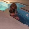 Fiona and Beverly carefully lower Natalie into the water before lifting her back out again.