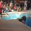 Tanice is lowered into the water by Fiona and Beverly.