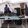 Ally Butterwick in his tent, working the technical equipment